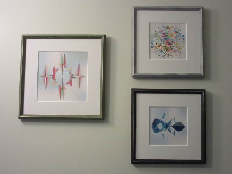 3 spirograph pictures hanging on wall